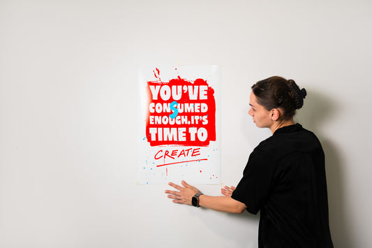 IT’S TIME TO CREATE A2 poster print displayed on a white wall next to the artist